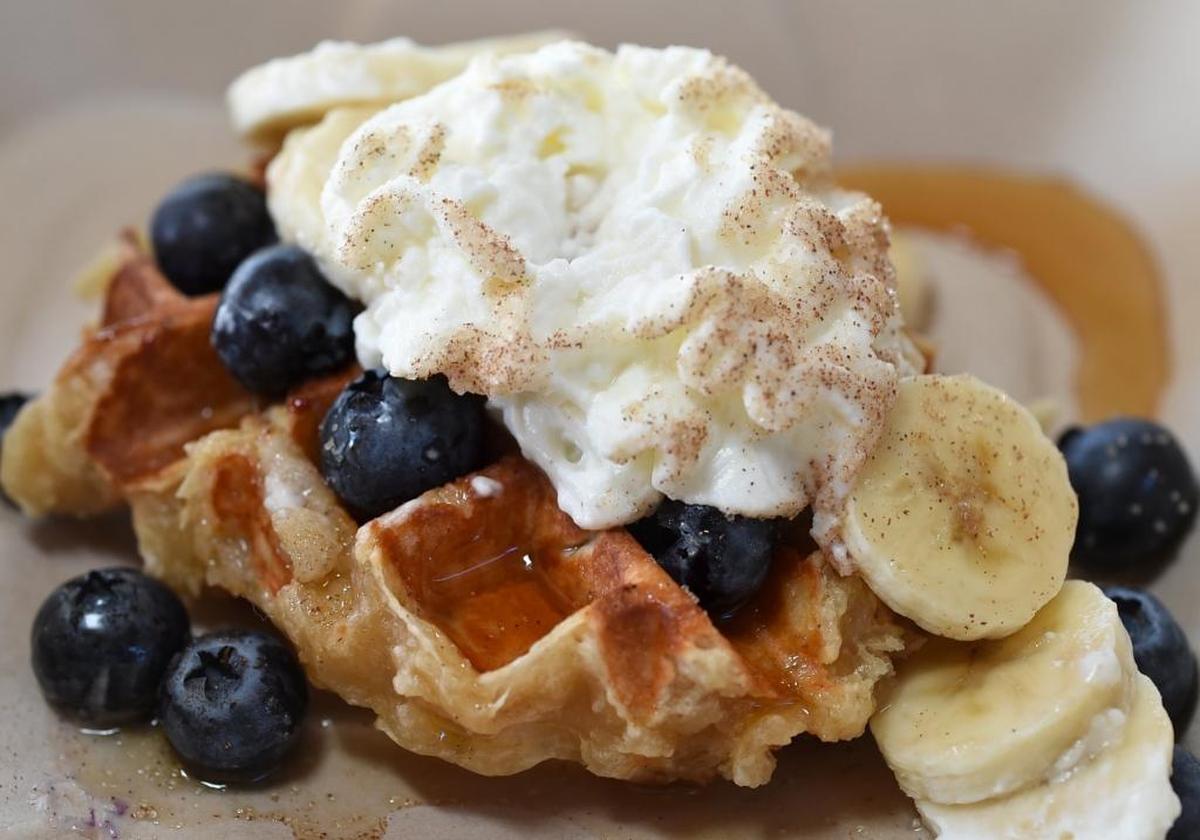 A Liege waffle – this one served with blueberries, bananas, whipping cream, cinnamon and syrup – from the Wafflicious truck.