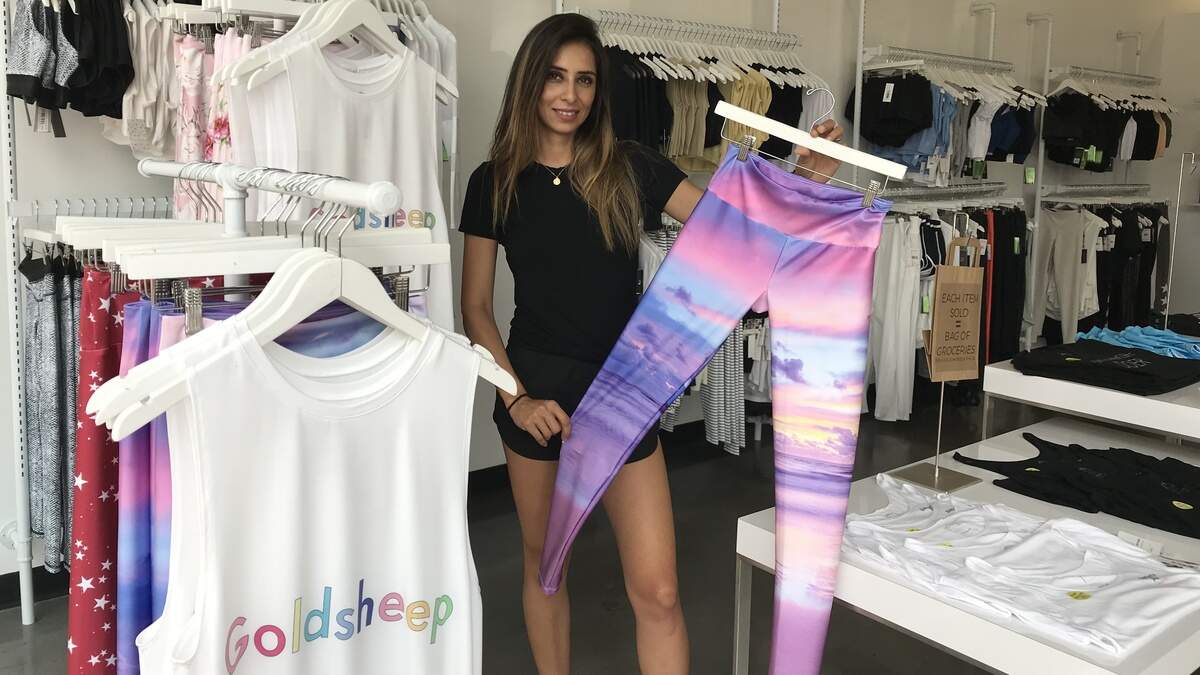 Alma Wolverton, owner of MANTRA, displays leggings her River Park store. The store is closing Nov. 1 but the merchandise will be available at another River Park location.
