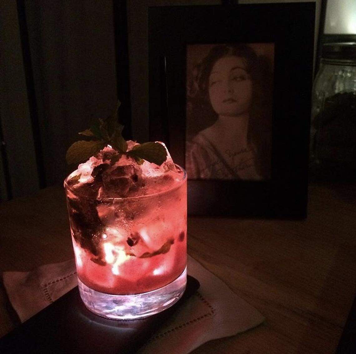 The bramble, a cocktail made with gin and blackberries, is served the Tower District’s speakeasy, The Library at Detention.