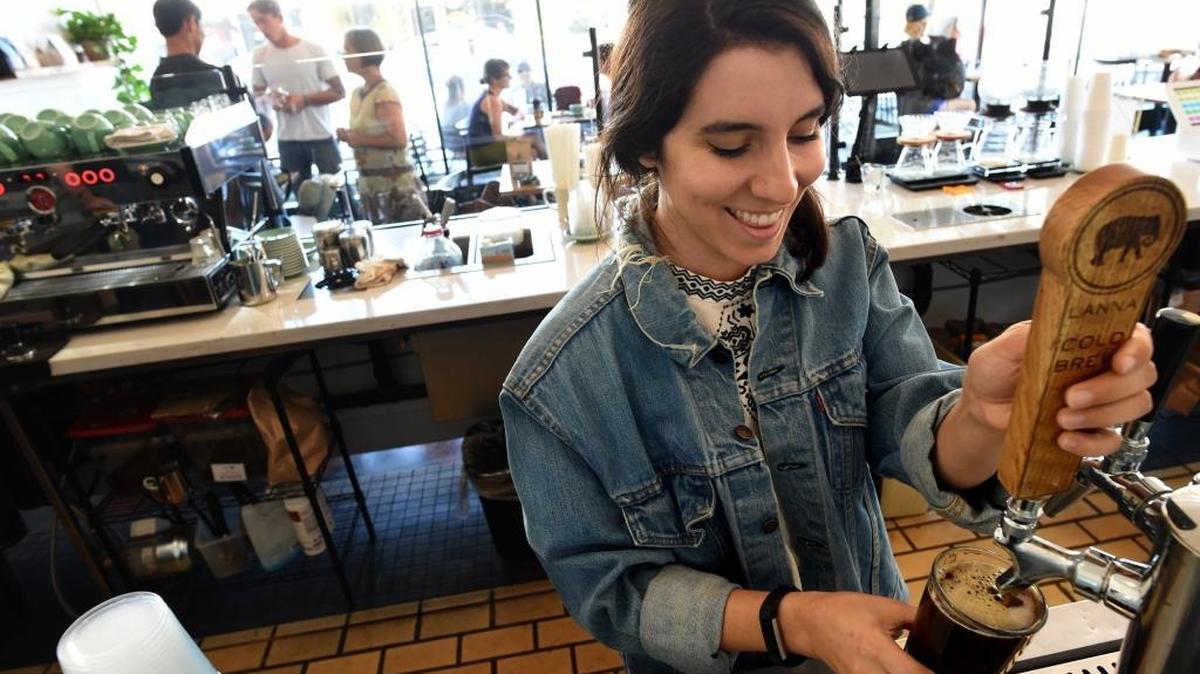 Juliann Love pours a cold brew coffee at The Revue in this file photo from 2017. The Tower District coffee shop has been sold to the owner of Component Coffee Lab in Visalia.