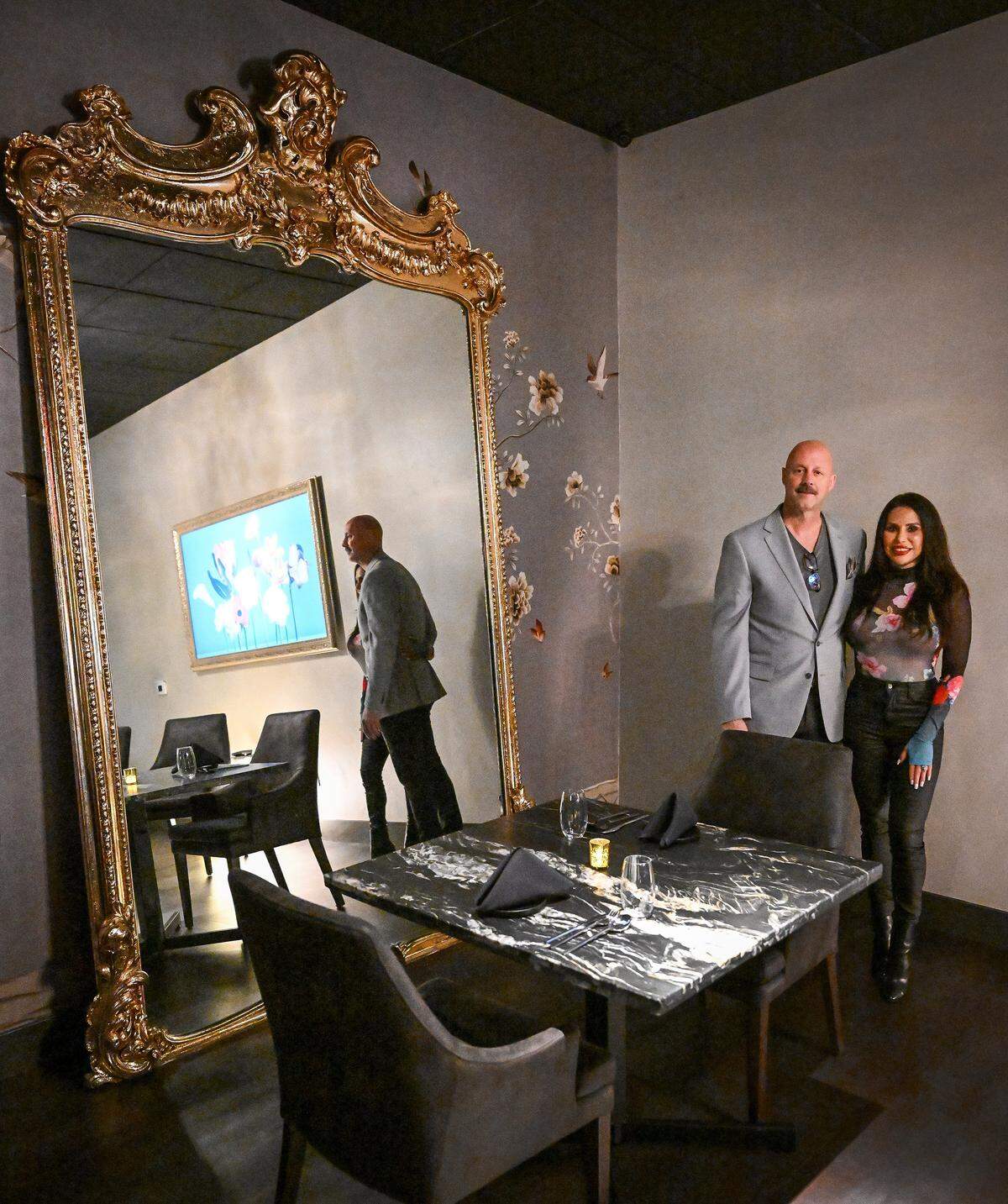 Tom and Davita Miller stand next to a 400-year-old mirror at their restaurant, Bulle, in northwest Fresno on Tuesday, April 22, 2026.