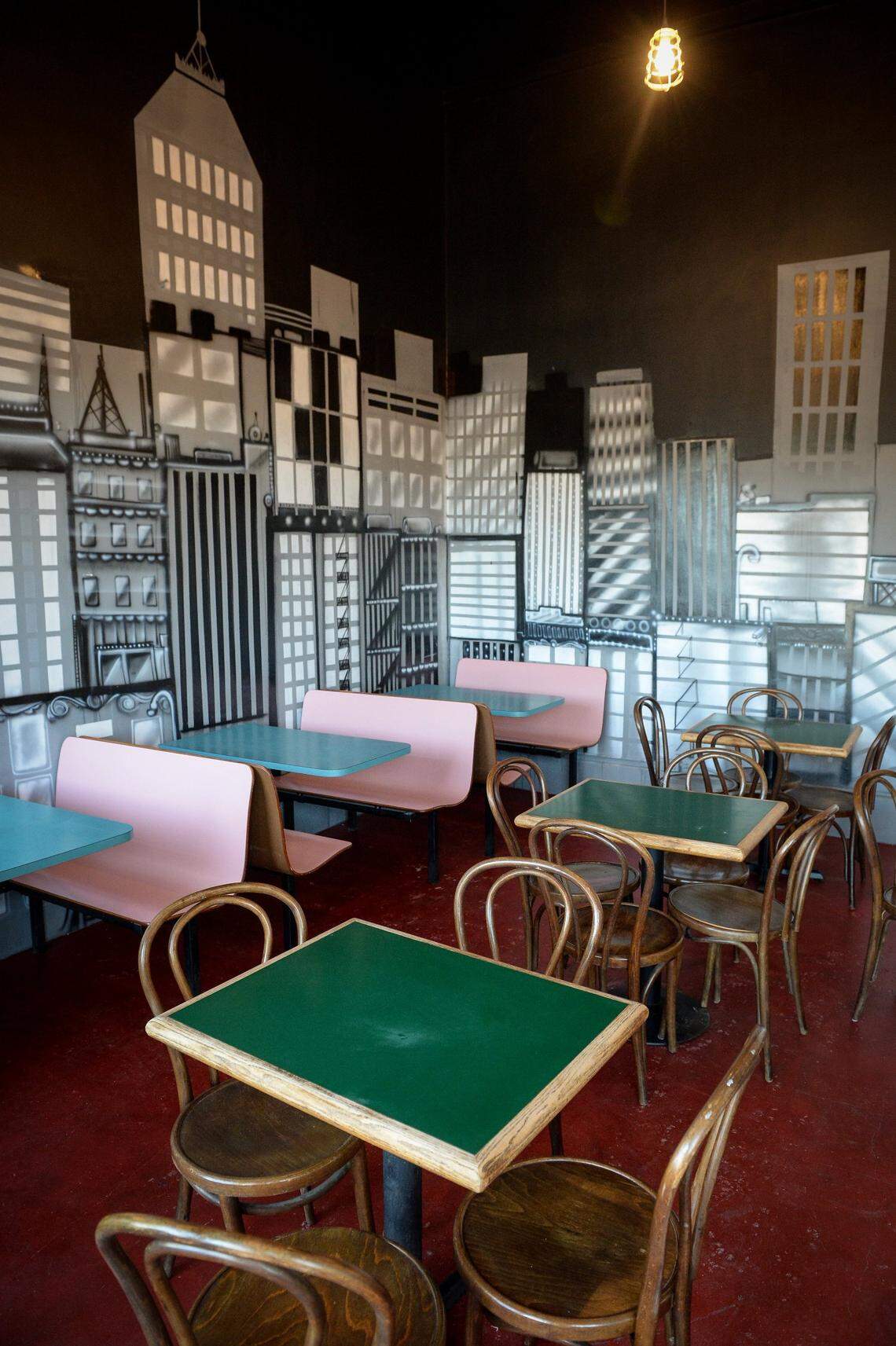 Tables and a downtown Fresno mural await customers for the scheduled Monday opening of Libelula, a farm-to-table restaurant next the the Crest Theater in downtown Fresno on Friday, March 15, 2019.