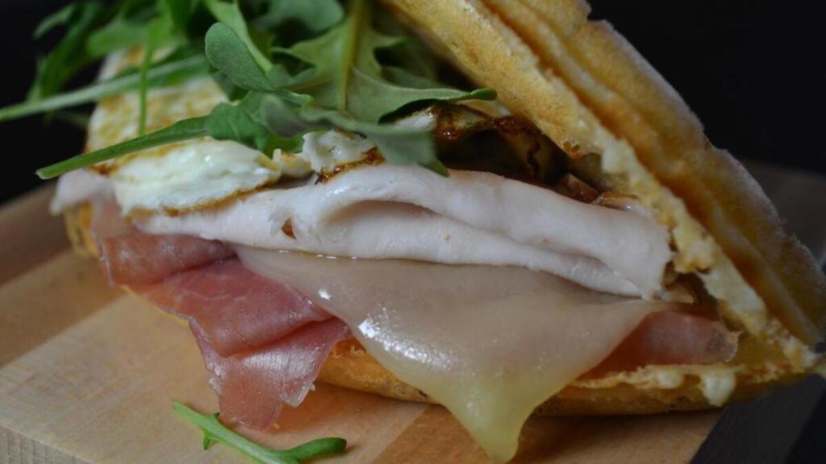 Sandwiches like this Monte Cristo with over-easy egg and arugula use waffles instead of bread at newly opened Griddle Me This, 7675 N. Blackstone Ave. in Fresno.