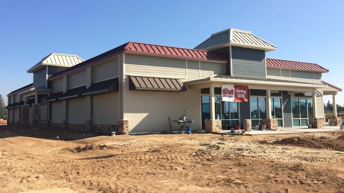 The newest building in the Park Crossing development, as seen from Friant Road, will be home to several restaurants and a nail salon.
