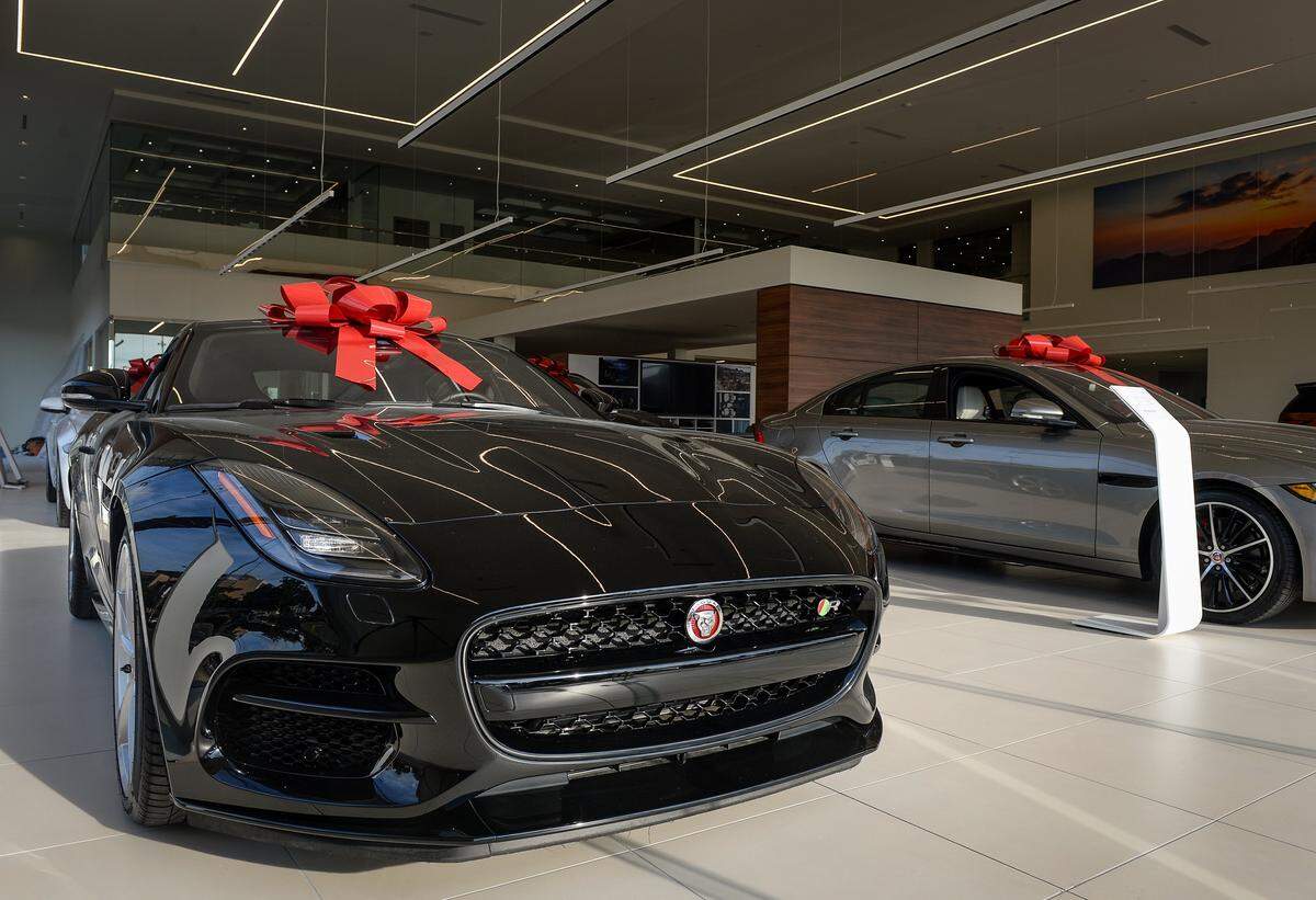 Jaguars are on display in the showroom of the new Haron Jaguar Land Rover dealership in downtown Fresno in this file photo from 2018.