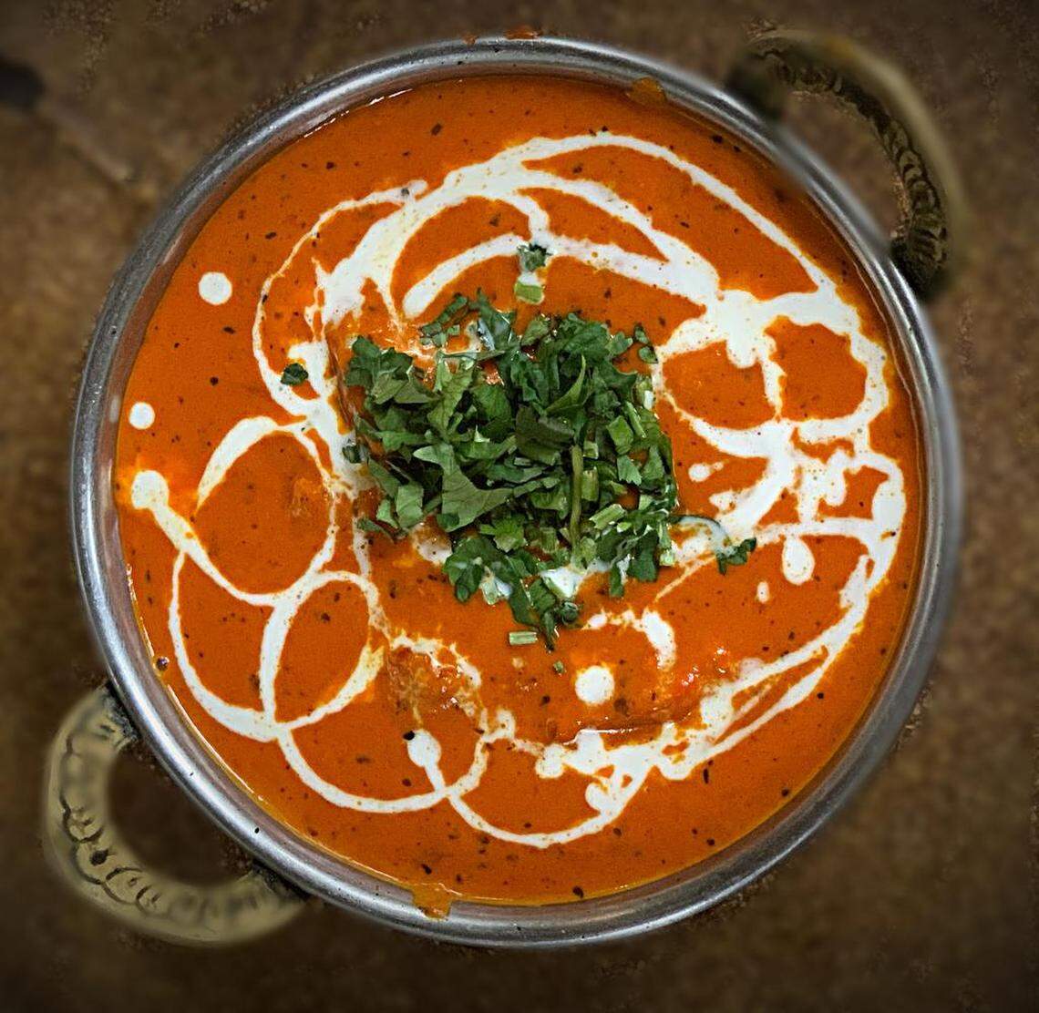 The butter chicken is the most popular dish, along with garlic naan, from India’s Oven restaurant in Fresno. After being closed during much of the Covid-19 pandemic, it has reopened.