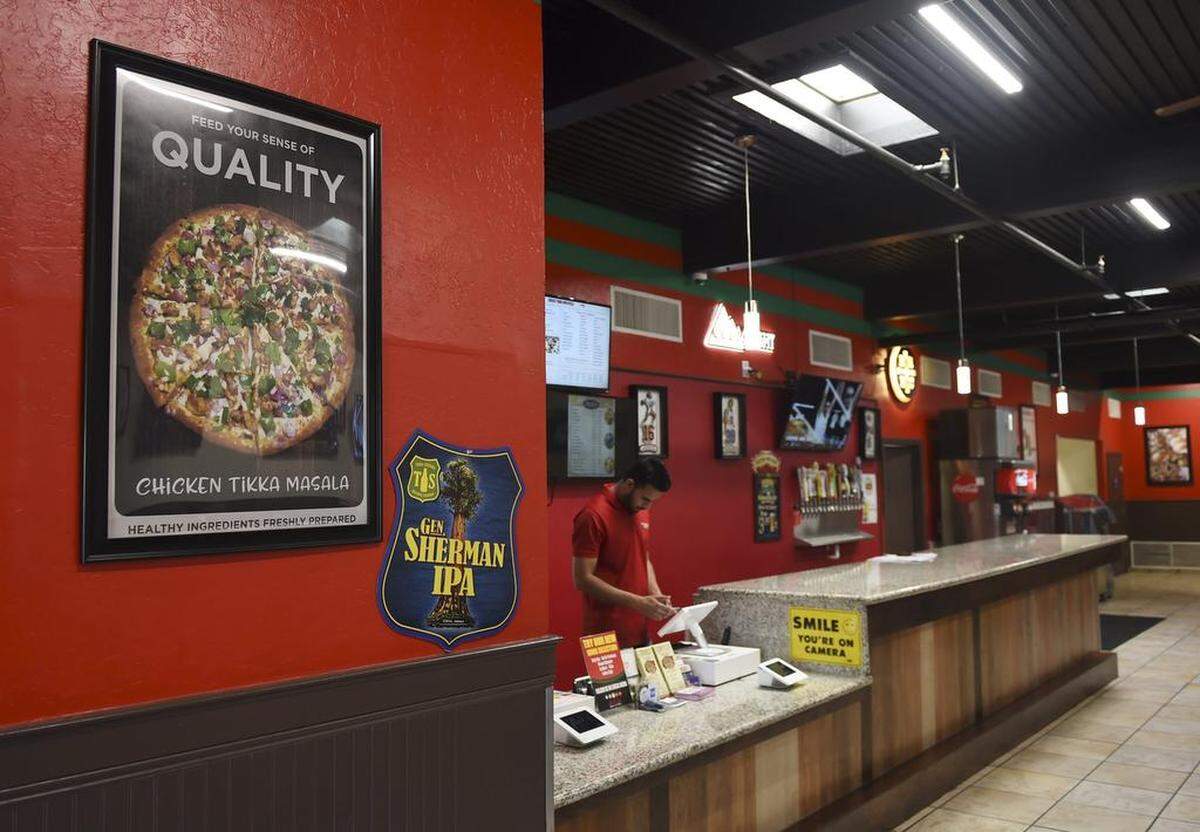 Chicago's Pizza With-A-Twist at Kings Canyon and Clovis Avenues makes pizzas with Indian toppings and traditional pizzas.