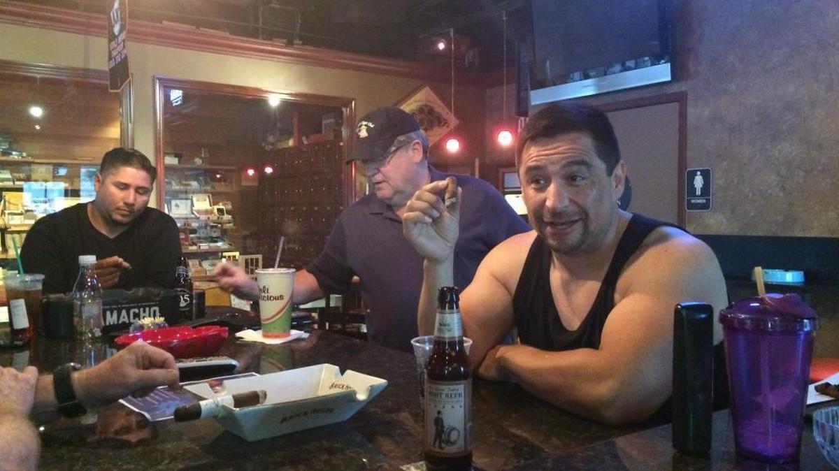 
Steve McComas enjoys a cigar and a “Not your father’s root beer” from Small Town Brewery at Cigar Mas Fino Wednesday, Sept. 23. The cigar lounge in northeast Fresno recently got the OK to start serving bottles of craft beer.
