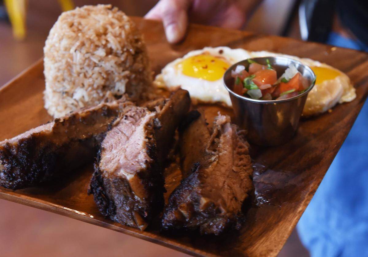 Adobosilog, baby back ribs with egg and garlic fried rice, served at Boba Silog, a new Filipino-fusion restaurant at Champlain and Perrin in Fresno Friday, Jan. 11, 2019. Boba Silog offers unique waffles and other items including pork adobo tacos with egg.