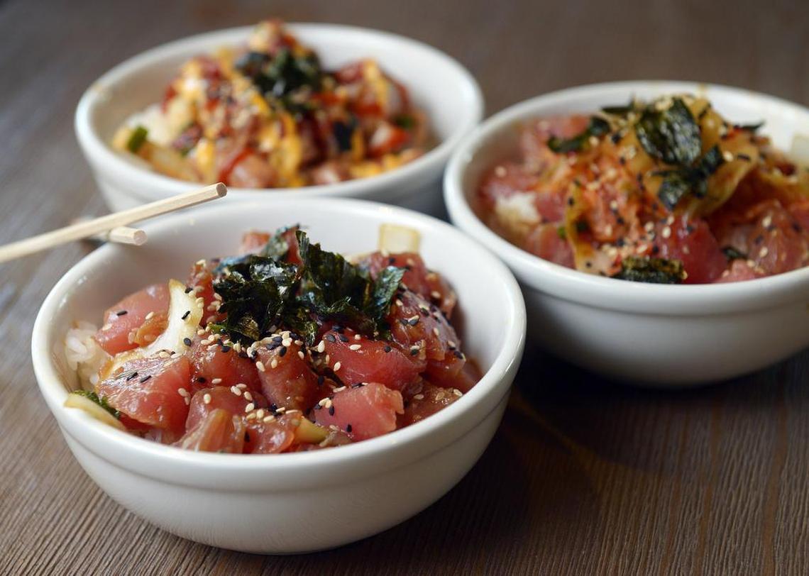 Poke bowls, clockwise from lower left, Hawaiian poke, spicy poke and kimchi poke, prepared at Rio Acai in Fresno Tuesday, August 16, 2016.