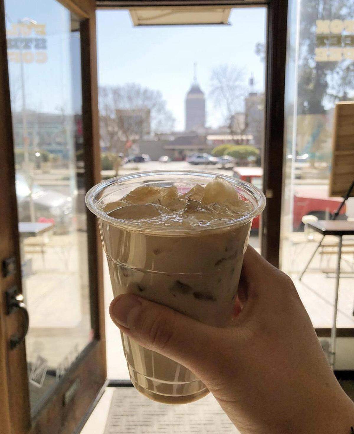 The cafe con leche at Fulton Street Coffee is made with cold brew coffee, milk, cinnamon and brown sugar.