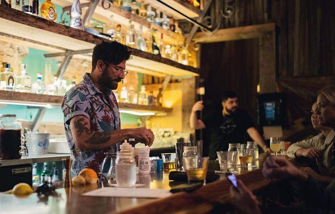 Josh Islas-Wolf, owner of future rooftop bar Quail State in downtown Fresno’s Pacific Southwest Building, works behind the bar at Los Panchos Mexican Restaurant on Fulton Street. Quail State is doing a “residency” at Los Panchos, taking over the bar on weekends while it continues to work on opening Quail State in its original location.