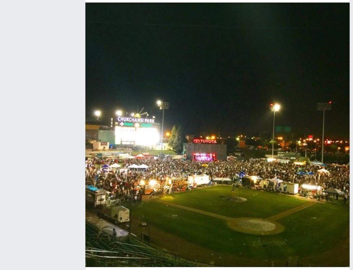 Taco fans pack the outfield during the eighth Taco Truck Throwdown last week in In this Facebook post by Sam Hansen.