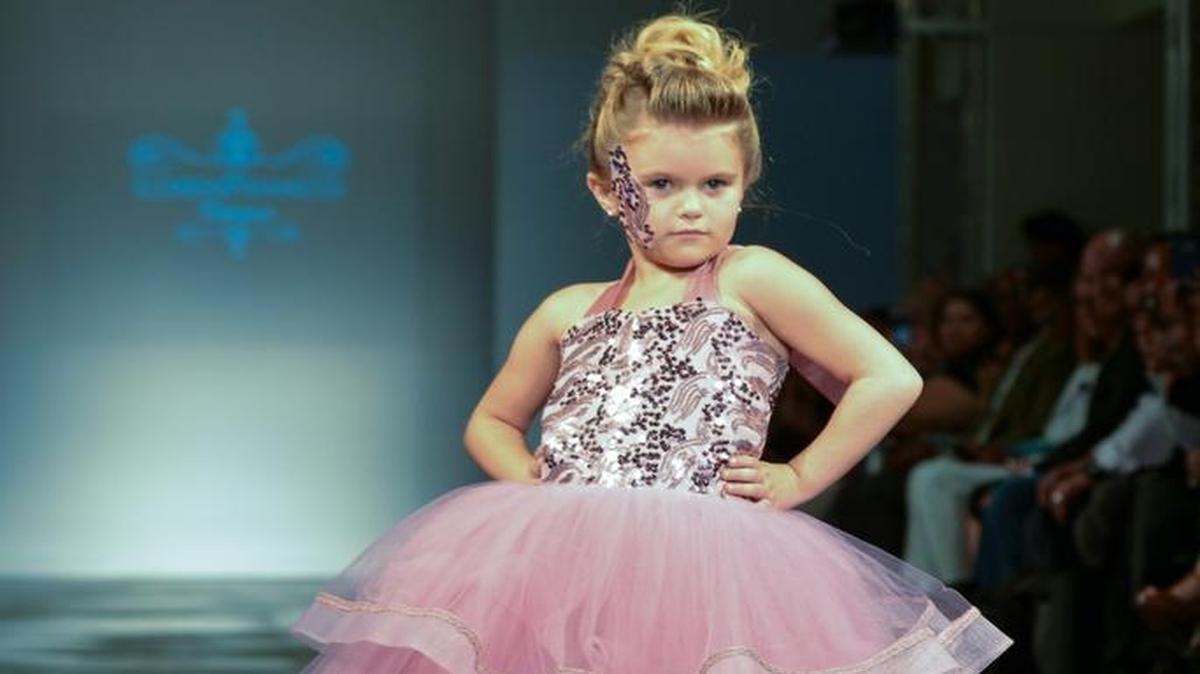 Katiana Upton, 4, of Fresno, walked down the runway at Fashion Week L.A. recently, modeling a dress for Dallas-based Loren Franco Designs.