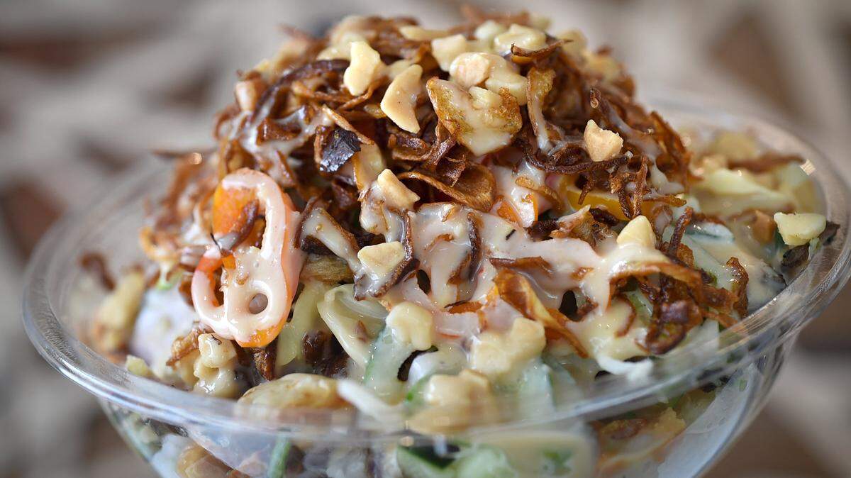 The Full Moon bowl, pictured here at Butterfish at the Clovis restaurant, is loaded with Thai beef, sushi rice, crispy wontons, chili lemongrass, kohlrabi slaw, sweet peppers, cucumber, jalapenos, honey cashew drizzle, crispy onions, macadamia nuts, and drizzled with a creamy sauce.