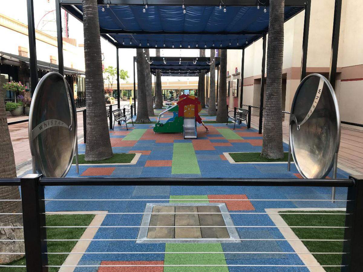 The newly remodeled playground at River Park has equipment that lets kids play with sound and music. Shade cloth covers the entire play area.