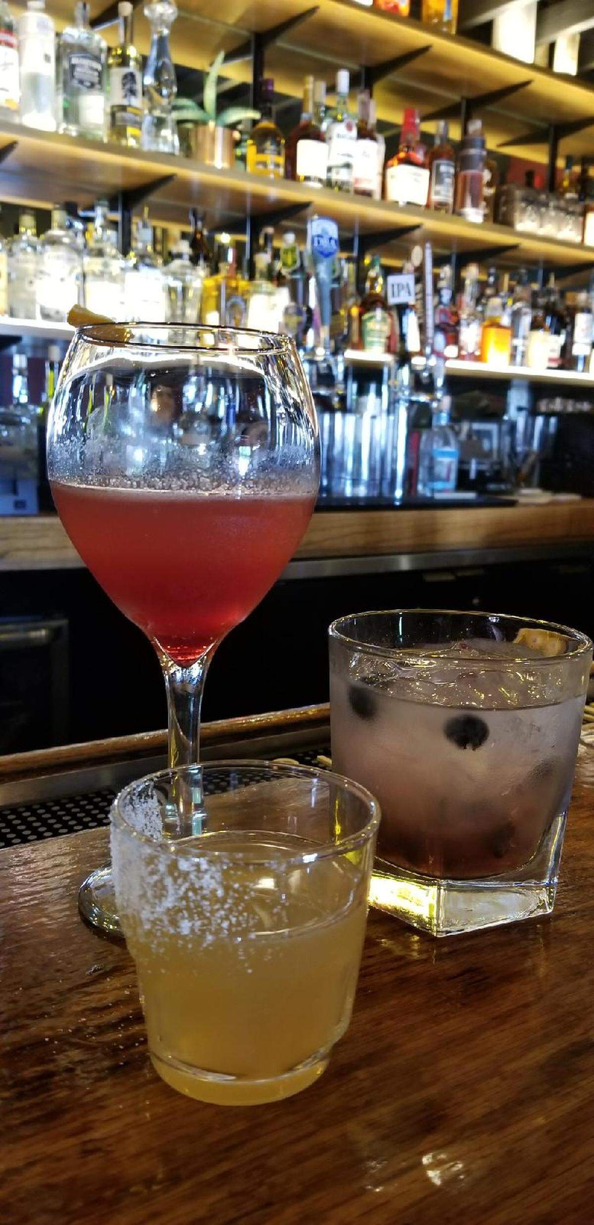 Cocktails like these are available at PaPa's Place in Clovis. Clockwise from top left: The Gatsby, the Somewhere and a sidecar.