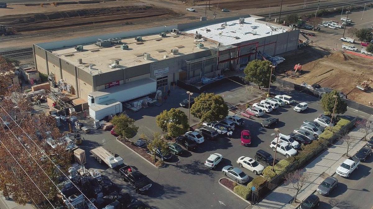 The Smart & Final on H and Ventura streets in downtown Fresno, seen in this aerial drone photo taken Tuesday, Dec. 5, 2017. The store is expanding to more than twice its original size, including more parking and a new loading dock. The new construction is on the right side of the building. Changes include 6,000 new club-size items, more shelves, a revamped produce section and expanded frozen, deli and meat selections.