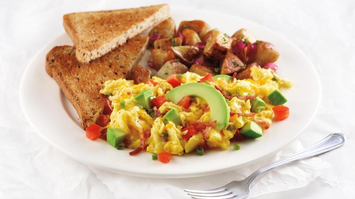 The Anaheim scrambler at Corner Bakery Cafe has three scrambled eggs with applewood smoked bacon, tomatoes, cheddar cheese and avocado.