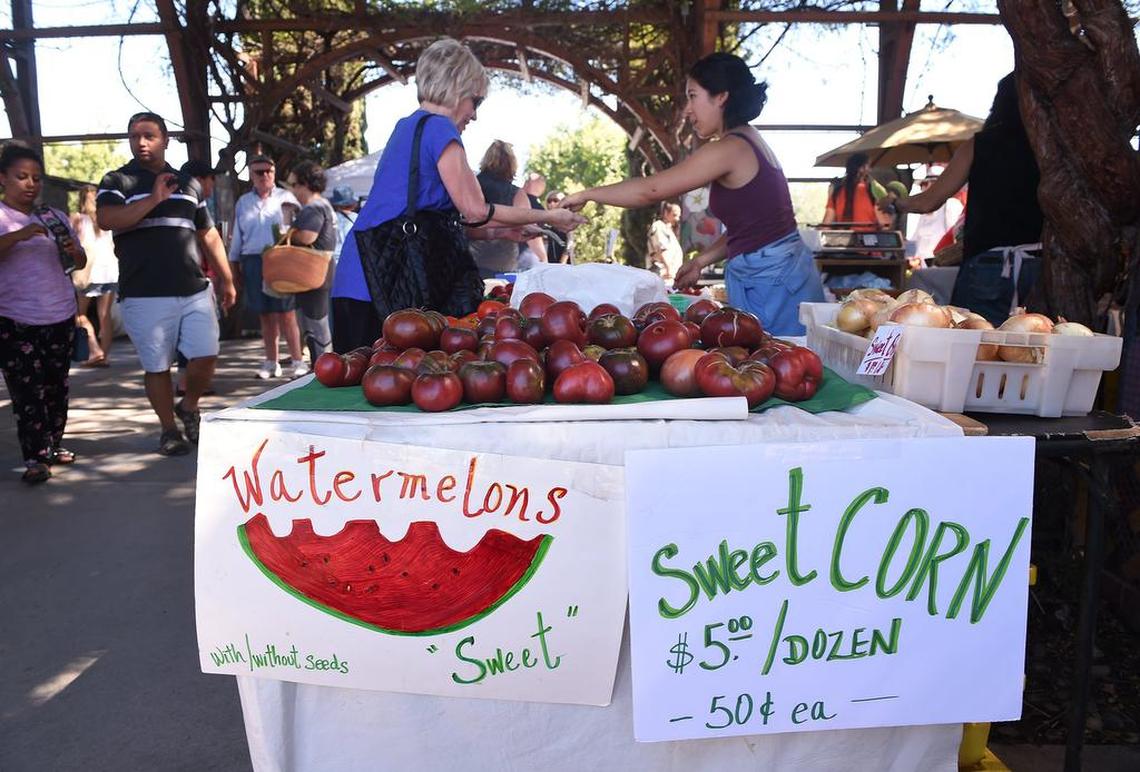 Fresh produce and more can always be found at local farmers markets, like watermelon and sweet corn at the Vineyard Farmers Market in Fresno in this scene from last July.