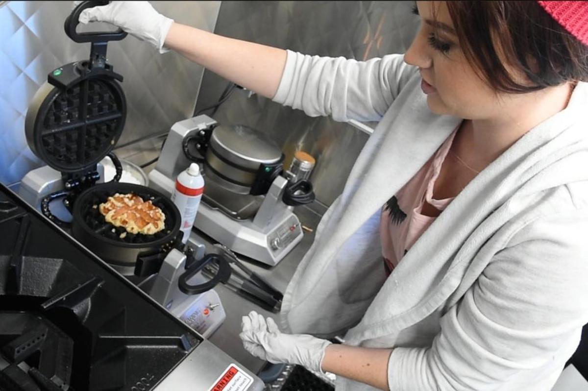 Allison Riggin, co-owner of the Wafflicious truck, makes a Liege waffle.