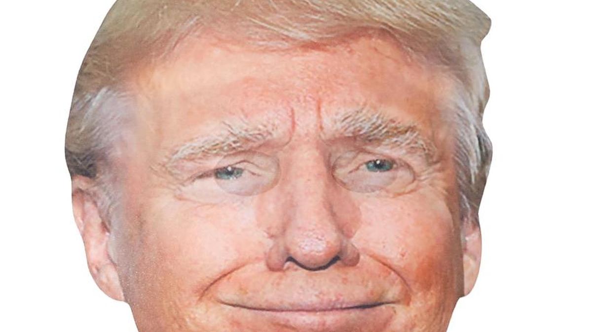 This year’s trendy and timely costumes are presidential candidate giant head masks, including this “smirking Trump” one from Spirit Halloween stores. The mask has sheer areas near the eyes so the person wearing it can see through the mask.