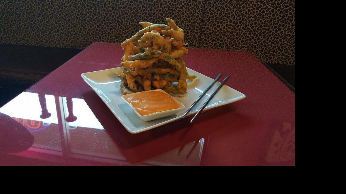
Tempura green beans at Zen Wok are a favorite of Yelp users. The beans are dipped in a housemade tempura batter, deep fried and served in a stack with Sriracha aioli.
