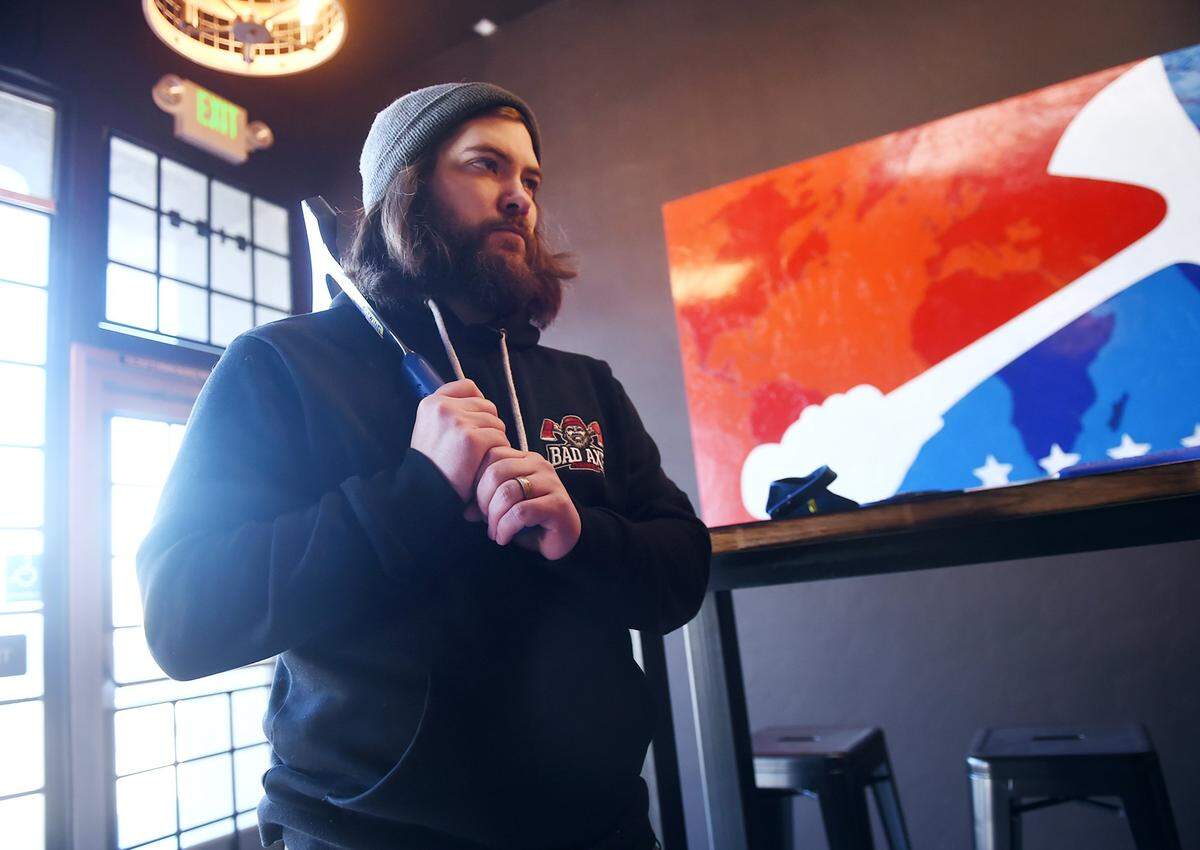 Kjai Block, Axe Master and operations manager for Bad Axe, at the new axe-throwing location in the former Stevens Bicycles at Palm and Shields Avenues Tuesday, Feb. 6, 2019 in Fresno.
