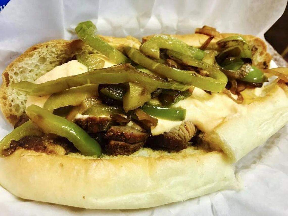 The Van Ness sandwich at Just the Tip is a French dip style sandwich with melted Swiss cheese, grilled onions and house au jus. The tri-tip is dry rubbed then grill smoked and sliced to order. Served on a basque bakery roll.