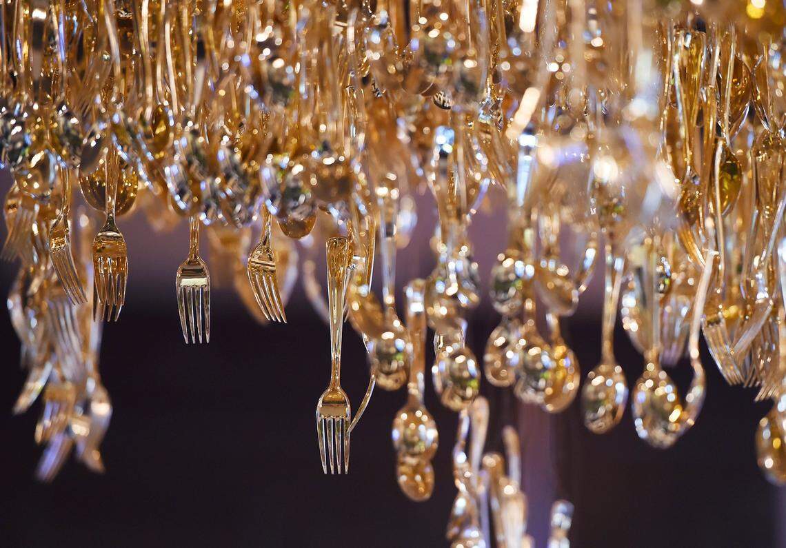 An artful centerpiece conversation starter of tableware, hangs from the ceiling at Mochuelo, a restaurant that has opened in the Piccadilly Inn on West Shaw in Fresno. Photographed Wednesday, Jan. 23, 2019 in Fresno.