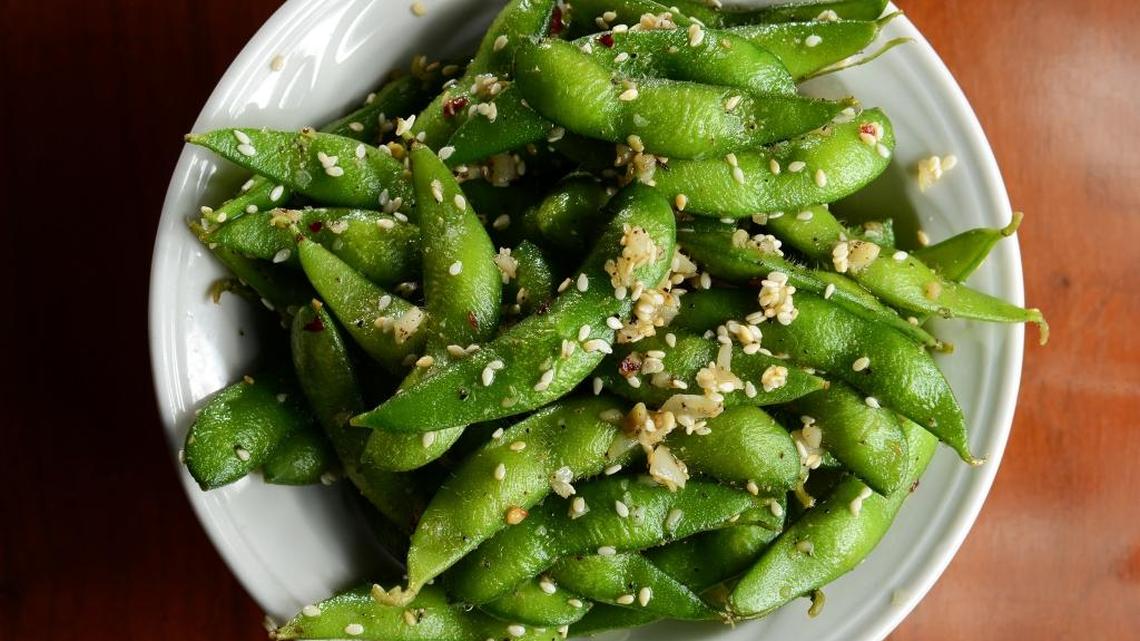Sauteed edamame with garlic and chili flakes prepared at Cafe Via in Fresno in 2013. The restaurant is closing this summer.