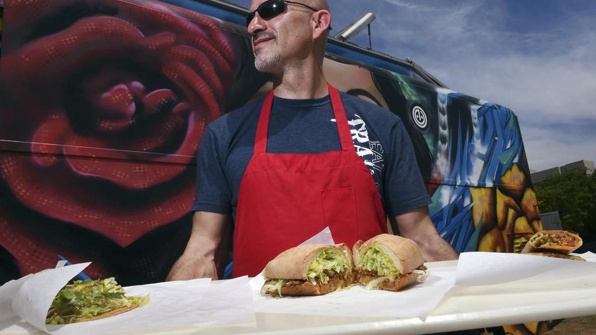 Juan Enriquez, owner of Latin Urban Bistro, serves up his unique special take on tortas and tacos as part of Fresno’s food truck scene. Latin Urban Bistro is among four trucks selling food at Fresno Streatz, a new food truck venue in downtown Fresno.