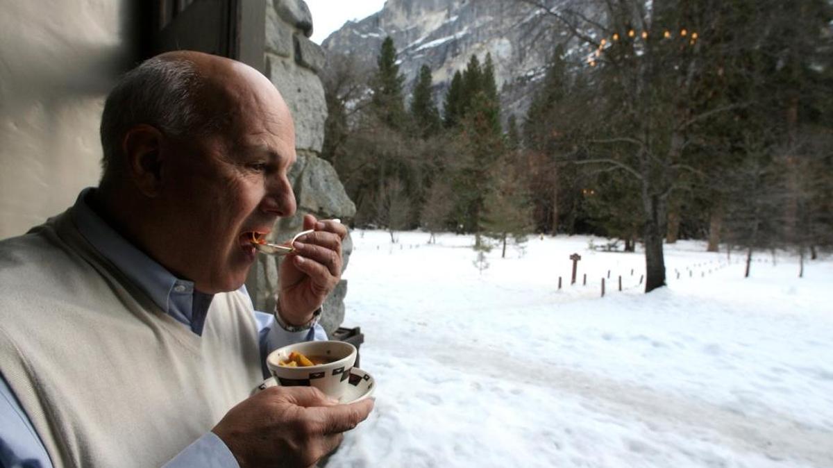 In this 2009 file photo, Mont Phelps of Boston, Mass., tastes a hot cup of Albodigas soup as he takes in the snowy Yosemite landscape, from inside the large windows of the historic Ahwahnee Hotel’s Solarium. Making of the soup was demonstrated by featured chef Traci des Jardins during the Chefs’ Holidays at The Ahwahnee. The next event will start Jan. 10, 2016.