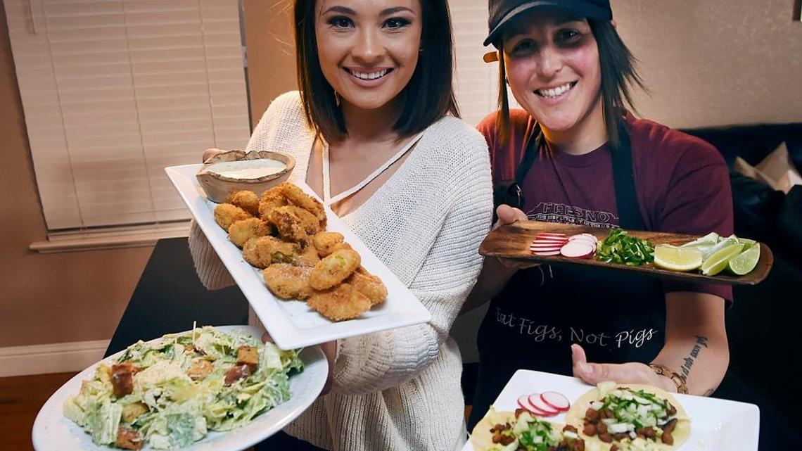 Ashley Hankins-Marchetti, left, and her wife Ashlee Marchetti, right, enjoy cooking vegan food. Hankins-Marchetti, creator of the blog Eat Figs Not Pigs, is hosting a pop-up brunch on July 23 at Root.