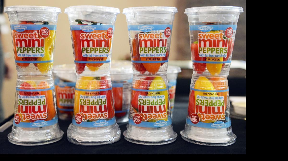
Mini pepper dipper cups from Baloian Farms are displayed at the Fresno Food Expo.
