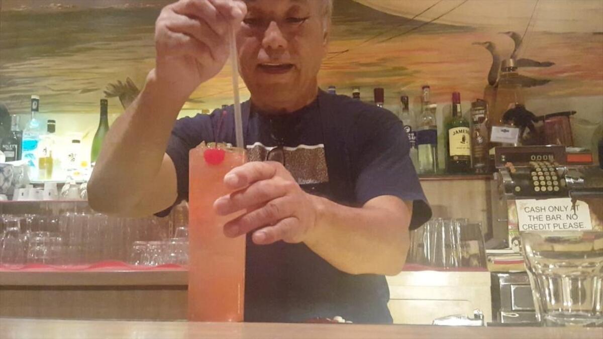 Tokyo Garden owner Toshi Yoshioka mixes his signature drink, a Singapore sling, on Sept. 28, 2017
