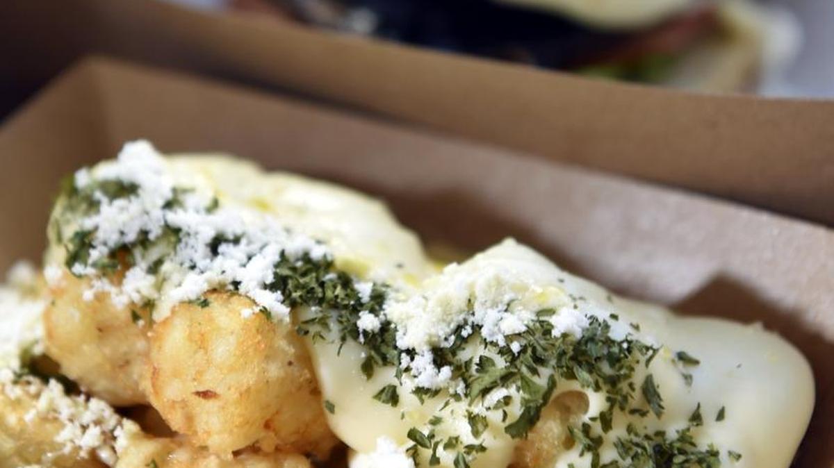 Char tots are a side dish made with homemade truffle cheddar sauce.