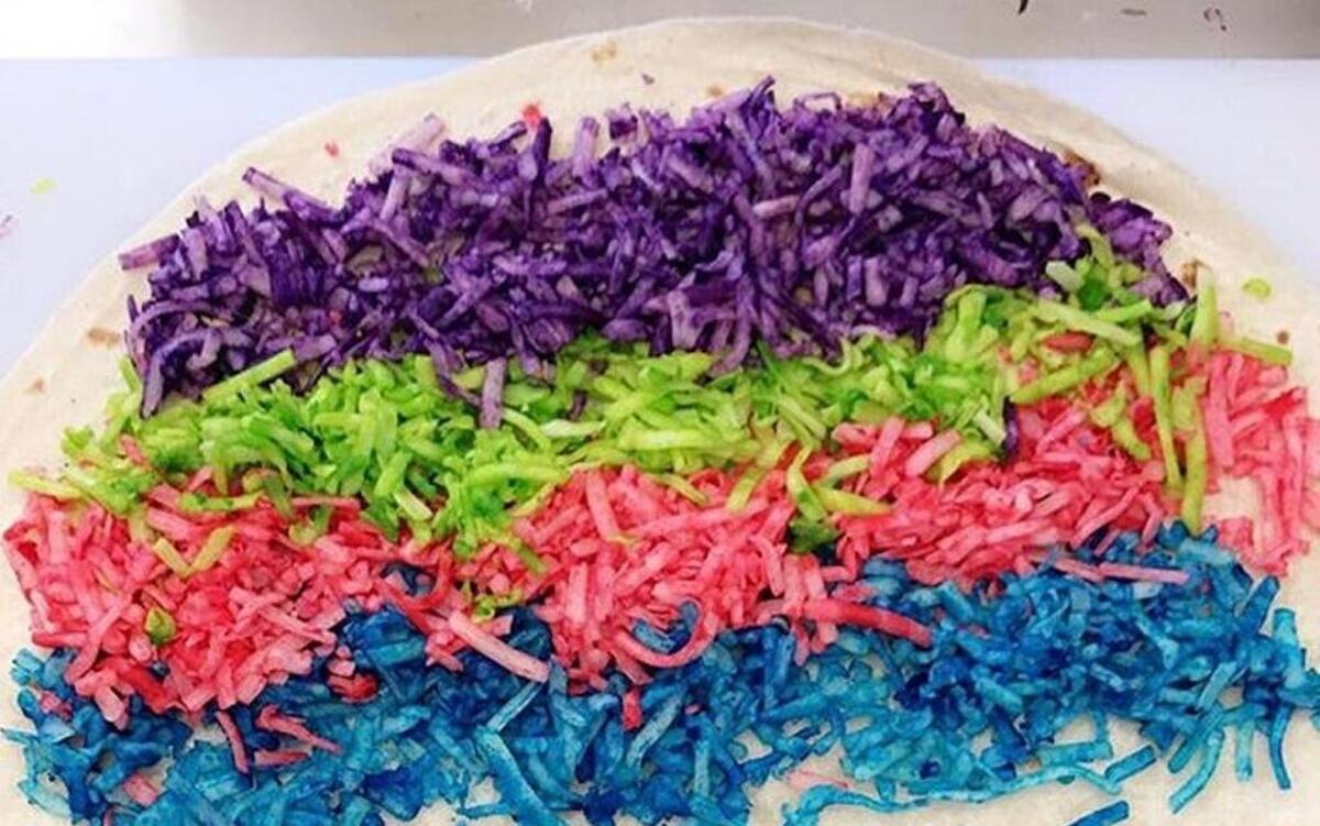 Pastel-colored cheese is what goes into the Unicorn Quesadilla from the El Premio Mayor food truck.