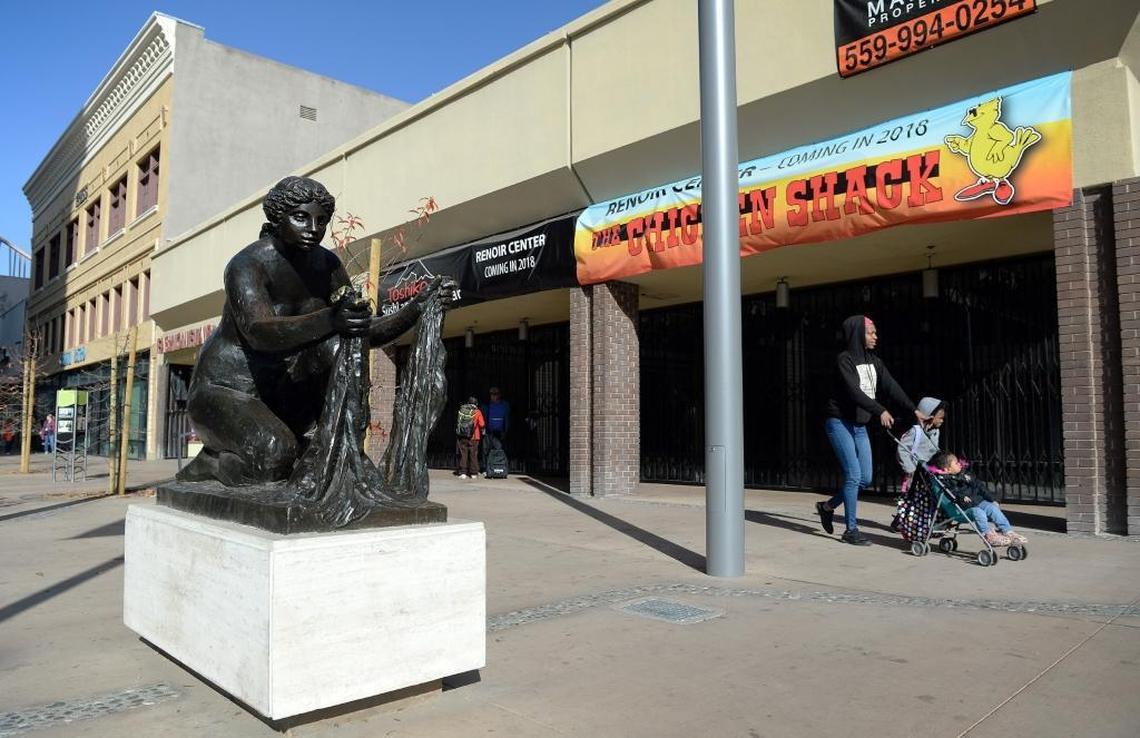 Renoir’s "The Washerwoman" sculpture stands on the sidewalk outside what will be known as Renoir Corner, where two restaurants, The Chicken Shack and Toshiko Japanese Cuisine, are planned at Mariposa and Fulton streets in downtown Fresno.