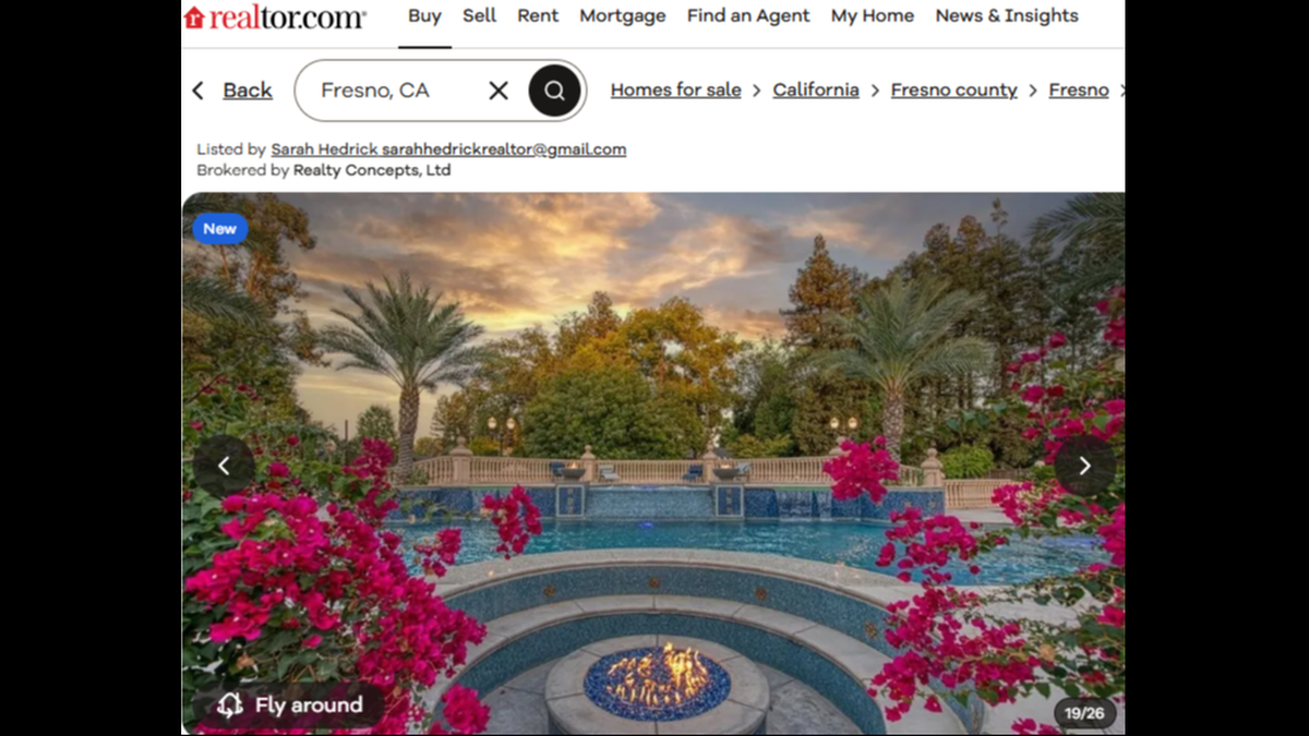 In the backyard, the “resort-style oasis” offers a step-down fire pit and a pool.
