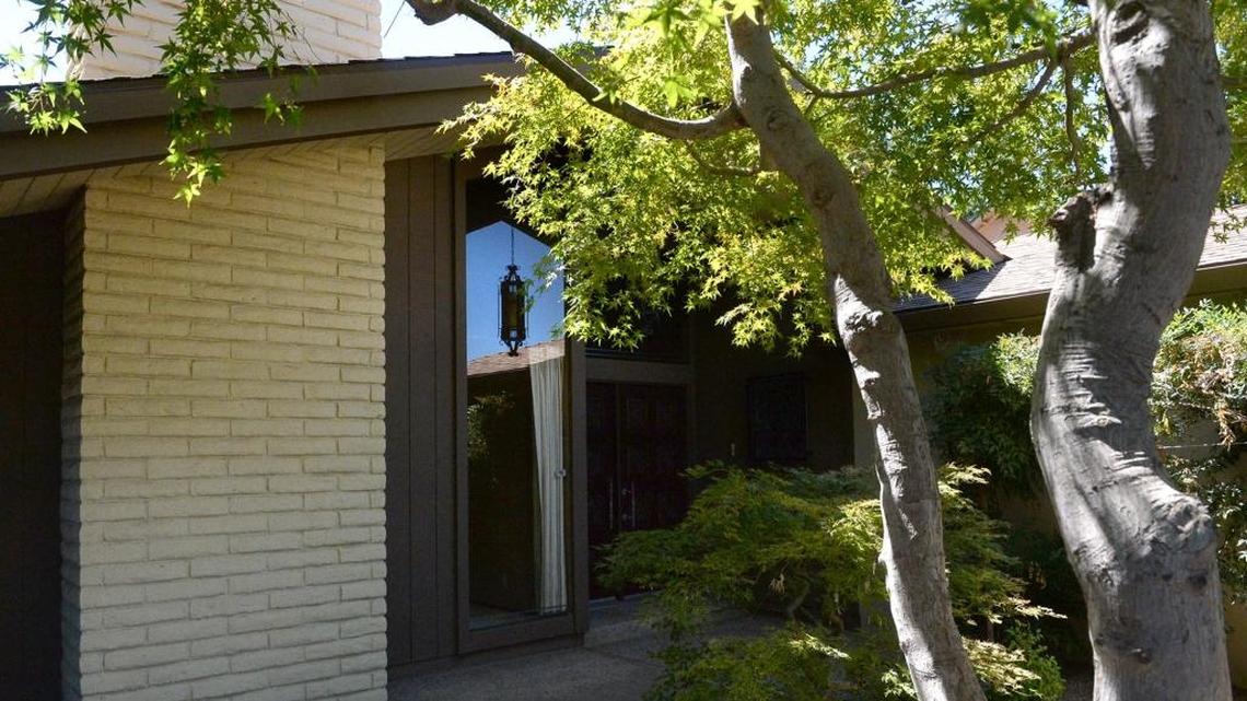 Mature Japanese maples grace the entrance of a central Fresno home.