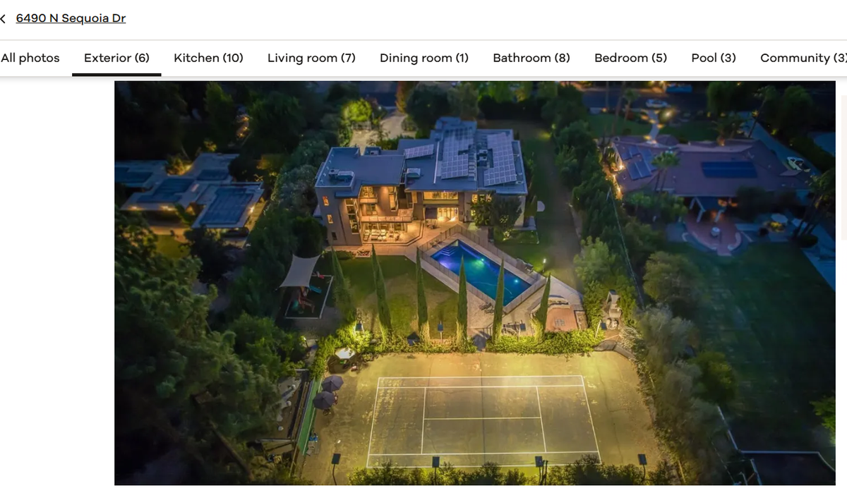 Outdoors, the home offers a saltwater pool, tennis court, an outdoor kitchen and gardens.