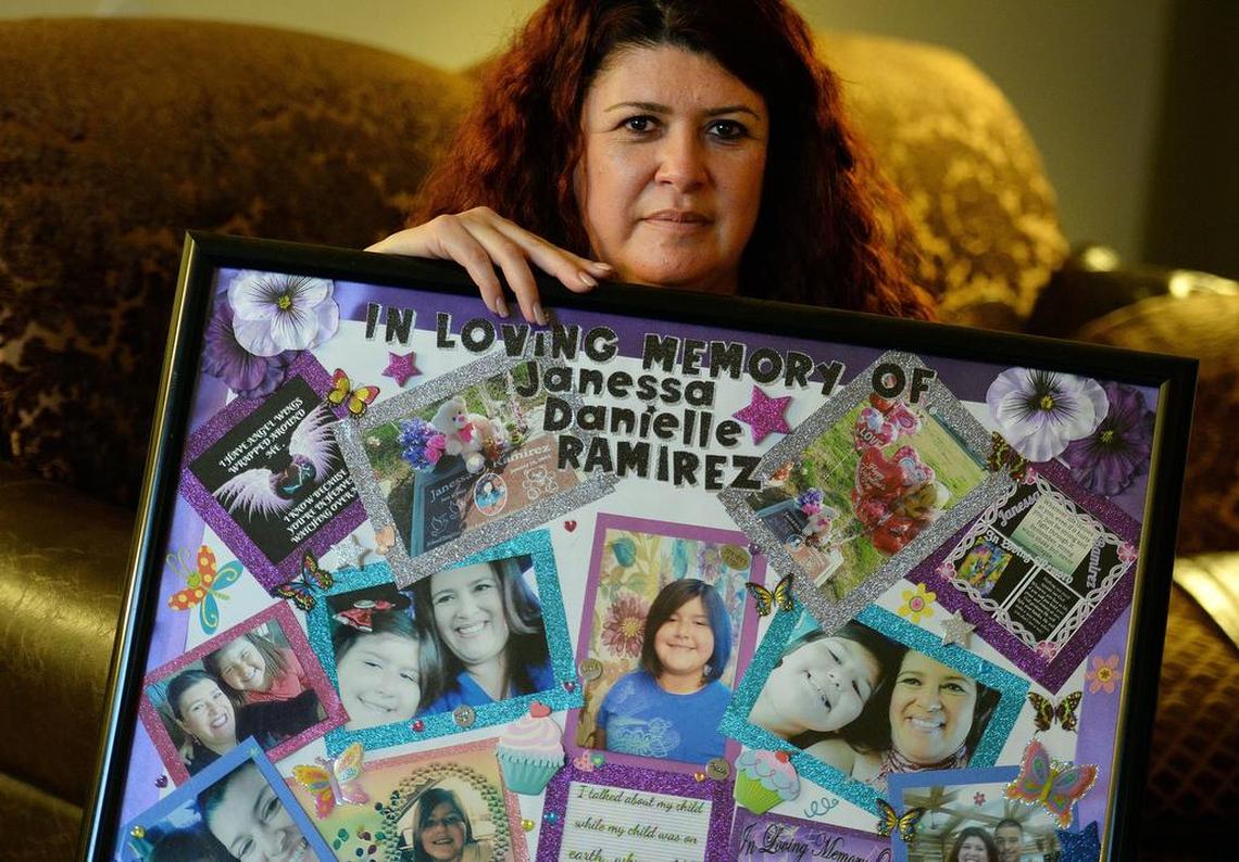 Stacey Gonzales, mother of shooting victim Janessa Ramirez, holds a poster collage of photos and selfies with Janessa at her home in Fresno in March 2018.