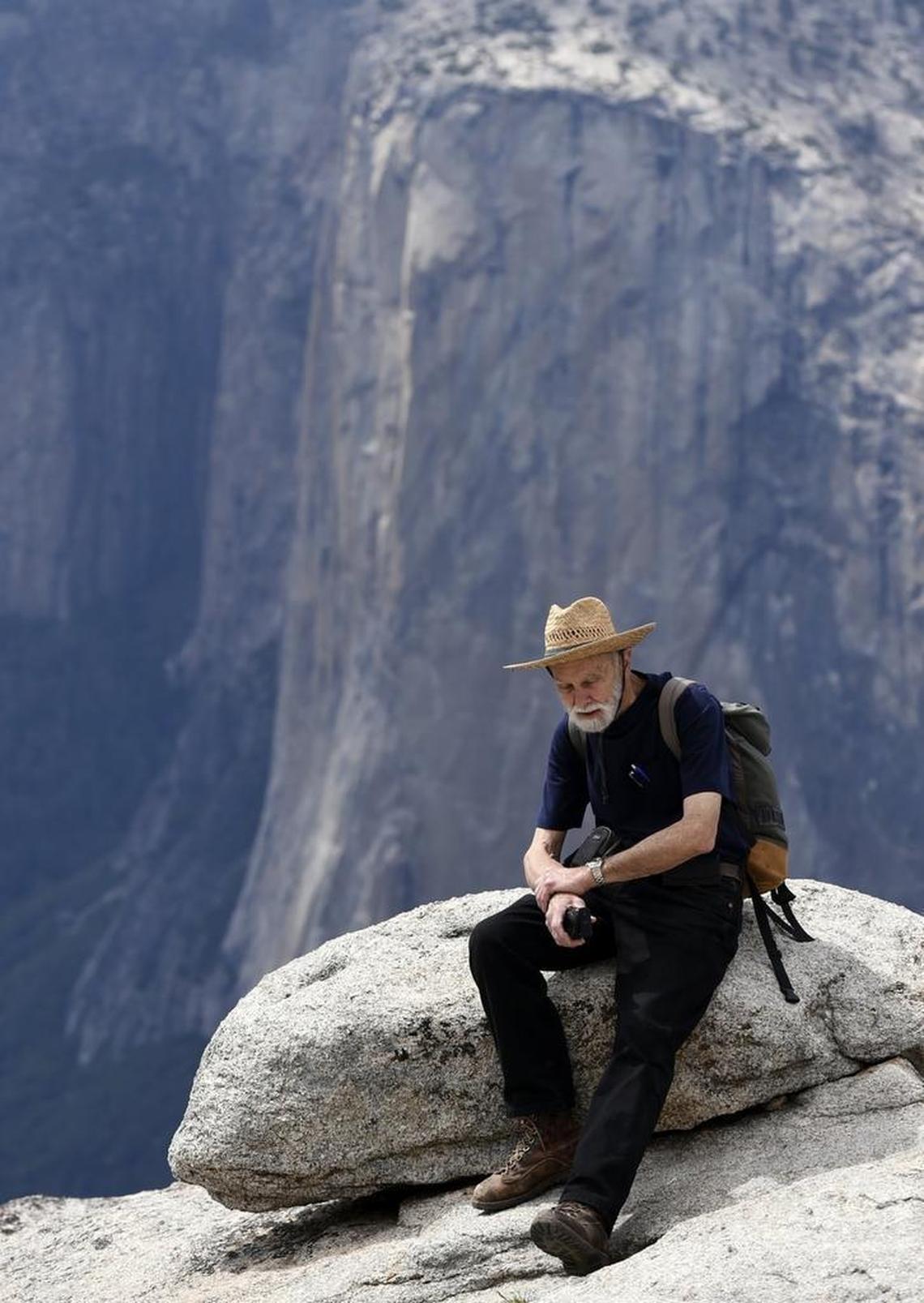 George Whitmore, then 85, sits at Taft Point with El Capitan in the background on May 26, 2016 in Yosemite National Park. He was one of three men on the first team to climb El Capitan in Yosemite Valley.