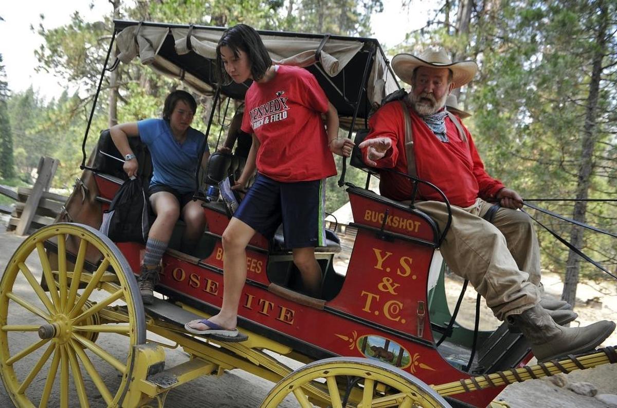 A Girl Scouts of Northern California Backing Interest Group (BIG) exits after a ride with Burrel “Buckshot” Rambo Maier, Wawona’s stagecoach driver in Yosemite National Park on Thursday, Aug. 3, 2017.