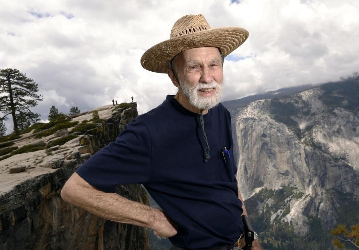 George Whitmore, 85, one of the three men on the first team to climb El Capitan in Yosemite Valley, is seen on a hike to Taft Point with El Capitan in the background across Yosemite Valley on May 26, 2016. .