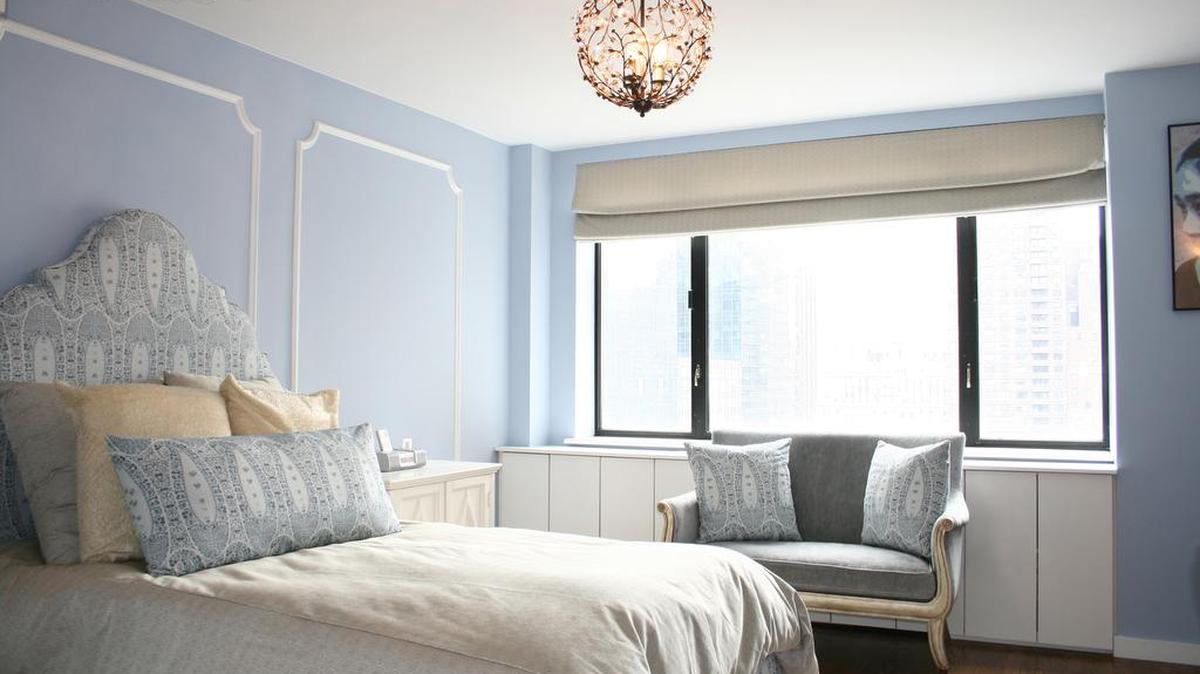 A Serenity blue bedroom paired with white can create a sense of Hollywood glamour.