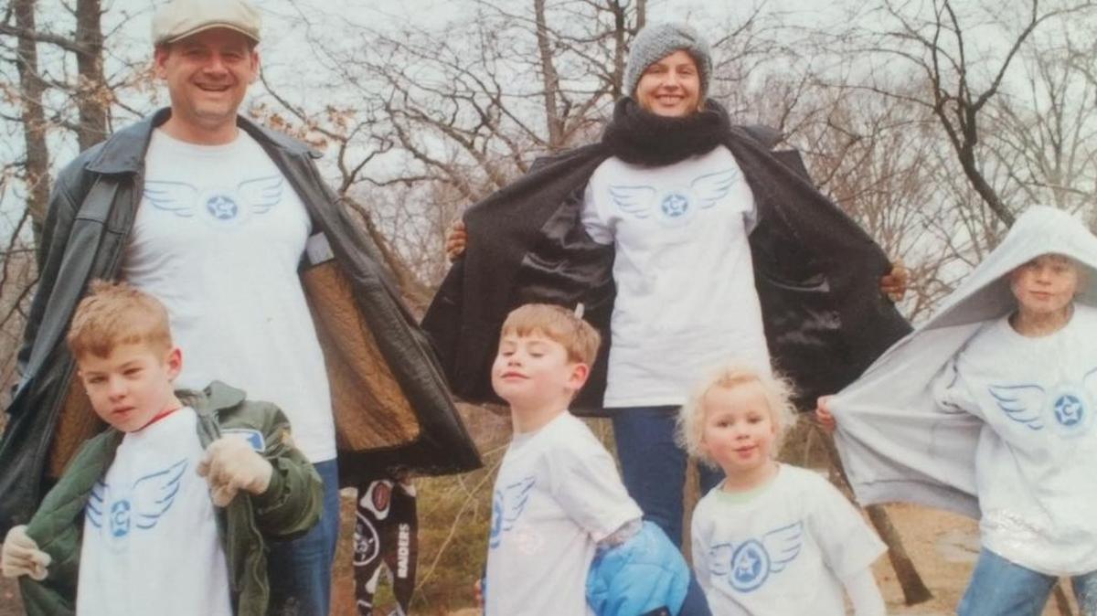
The De Granges show off their “Super Charlie” T-shirts, designed by Charlie’s cousin Jarrod. Proceeds went to support the family. Greg and Jessica De Grange are pictured here with their children, from left, Charlie, Myles, Giuliana and Garrett. Charlie’s dad, Greg, says the shield represents strength, faith and hope. The wings are the “angels that help him fly and fight DIPG for all children that cannot fight for themselves,” he says. “It is a symbol of his spirit, bravery and courage. He truly is my superhero.” 
