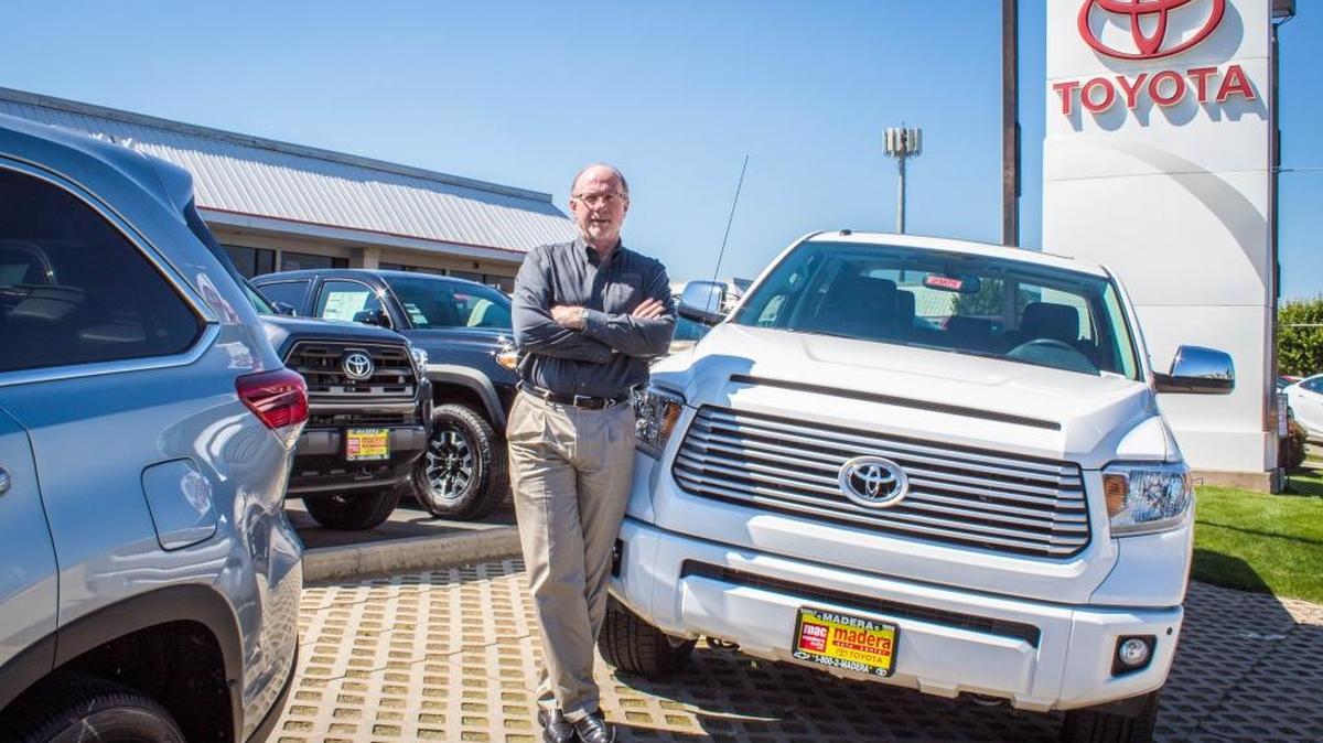 Marty Mayfohrt, chief executive officer of Madera Auto Center, in front of the dealership at 1300 Country Club Drive in Madera.