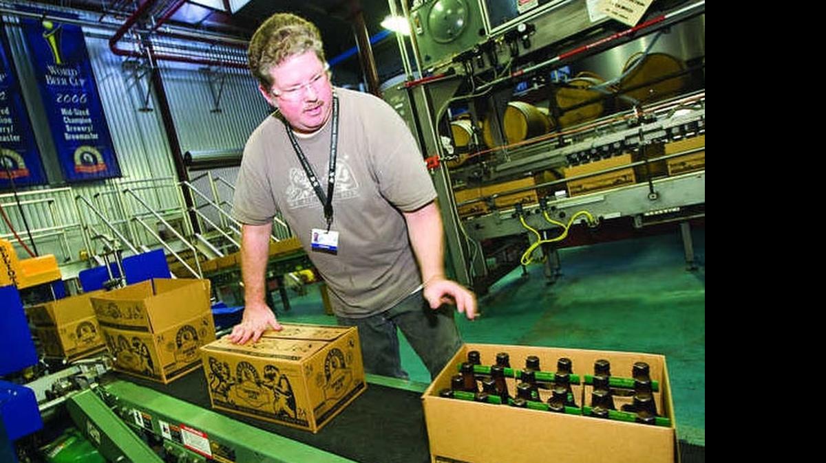 
Tony Guerro works in the bottling and packaging area of Firestone Walker Brewing Co. in Paso Robles. The brewery announced Thursday it would be combining with Belgian company Duvel Moortgat.
